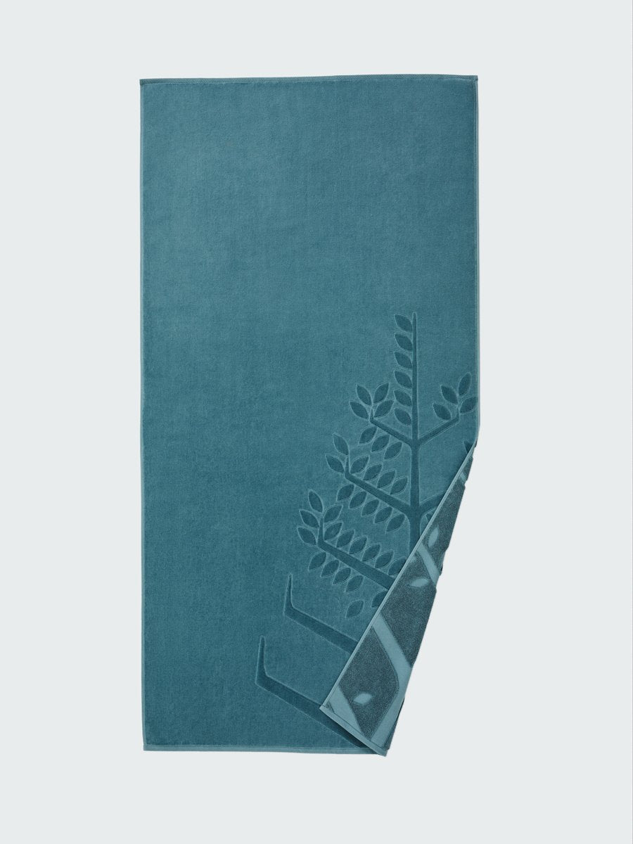 'Polynesian Lagoon' beach towel with an embossed Four Seasons logo. Part of the towel is folded back to reveal the same design on the bottom. - {{Polynesian Lagoon}}