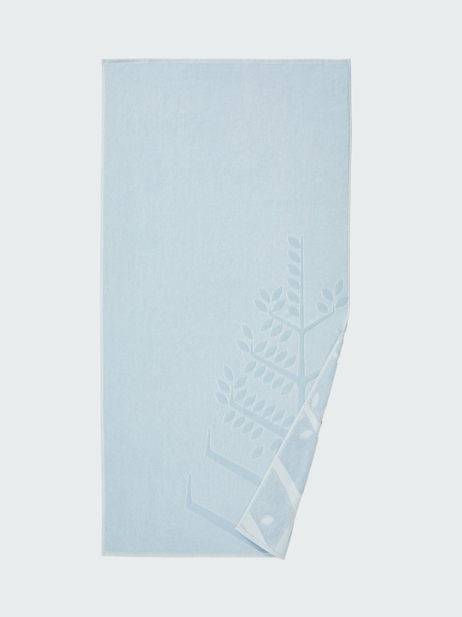 'Maldivian Atoll' beach towel with an embossed Four Seasons logo. Part of the towel is folded back to reveal the same design on the bottom. - {{Maldivian Atoll}}