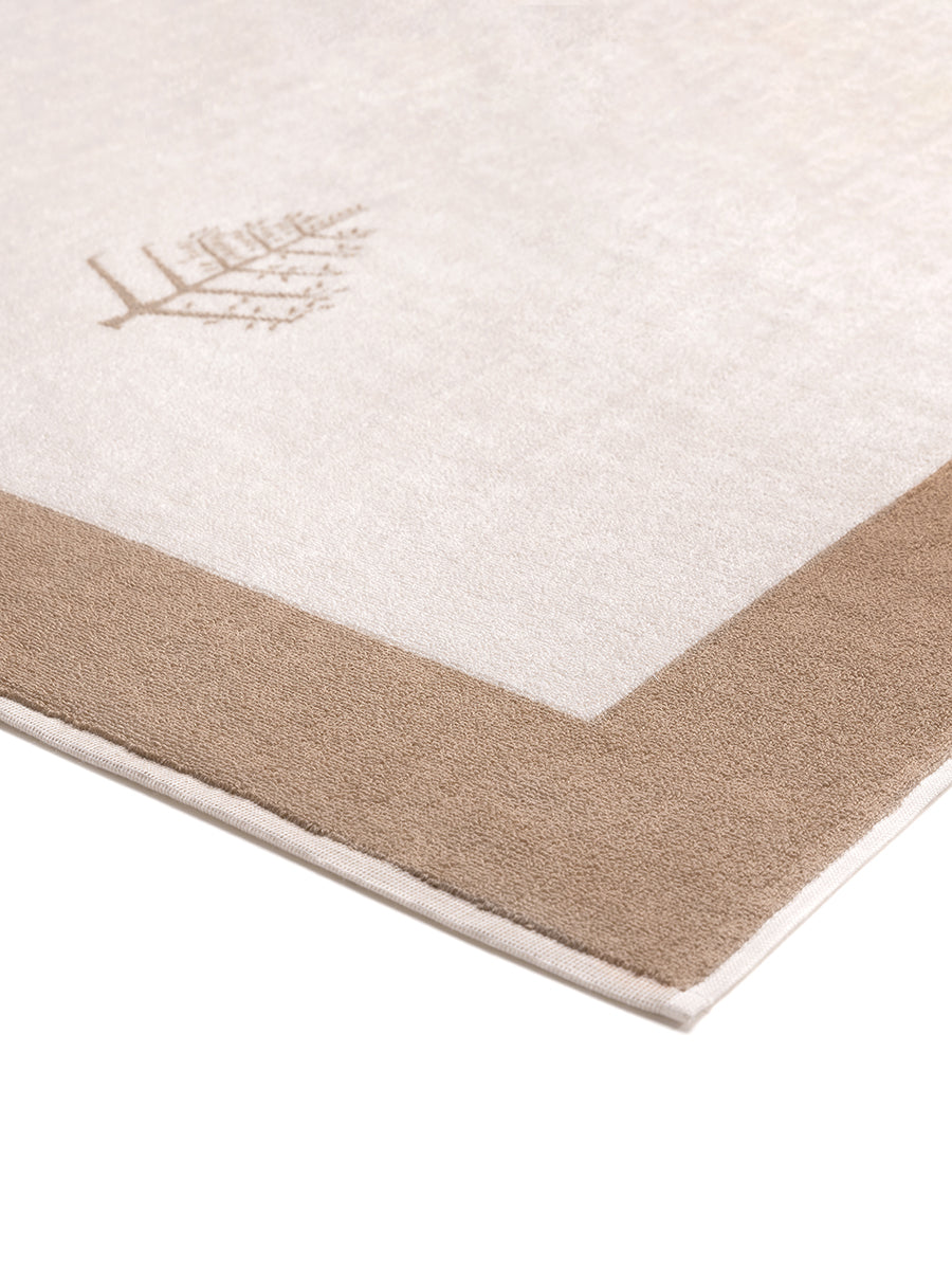Close-up of a "Californian Driftwood" Resort Towel with a subtle embroidered Four Seasons logo. The towel features a darker "Californian Driftwood" border. - {{Californian Driftwood}}