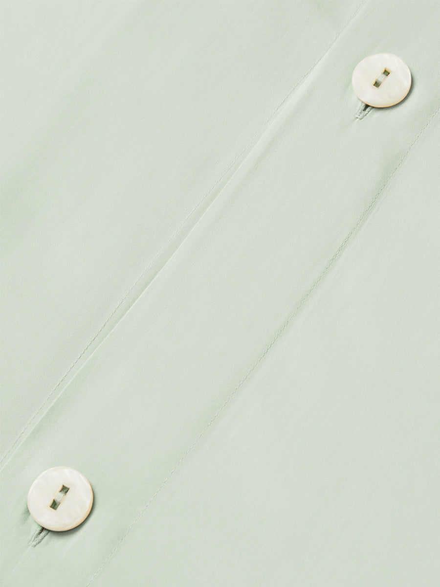 Close-up of hidden button closure on the Florentine Sage duvet cover. {{Florentine Sage}}