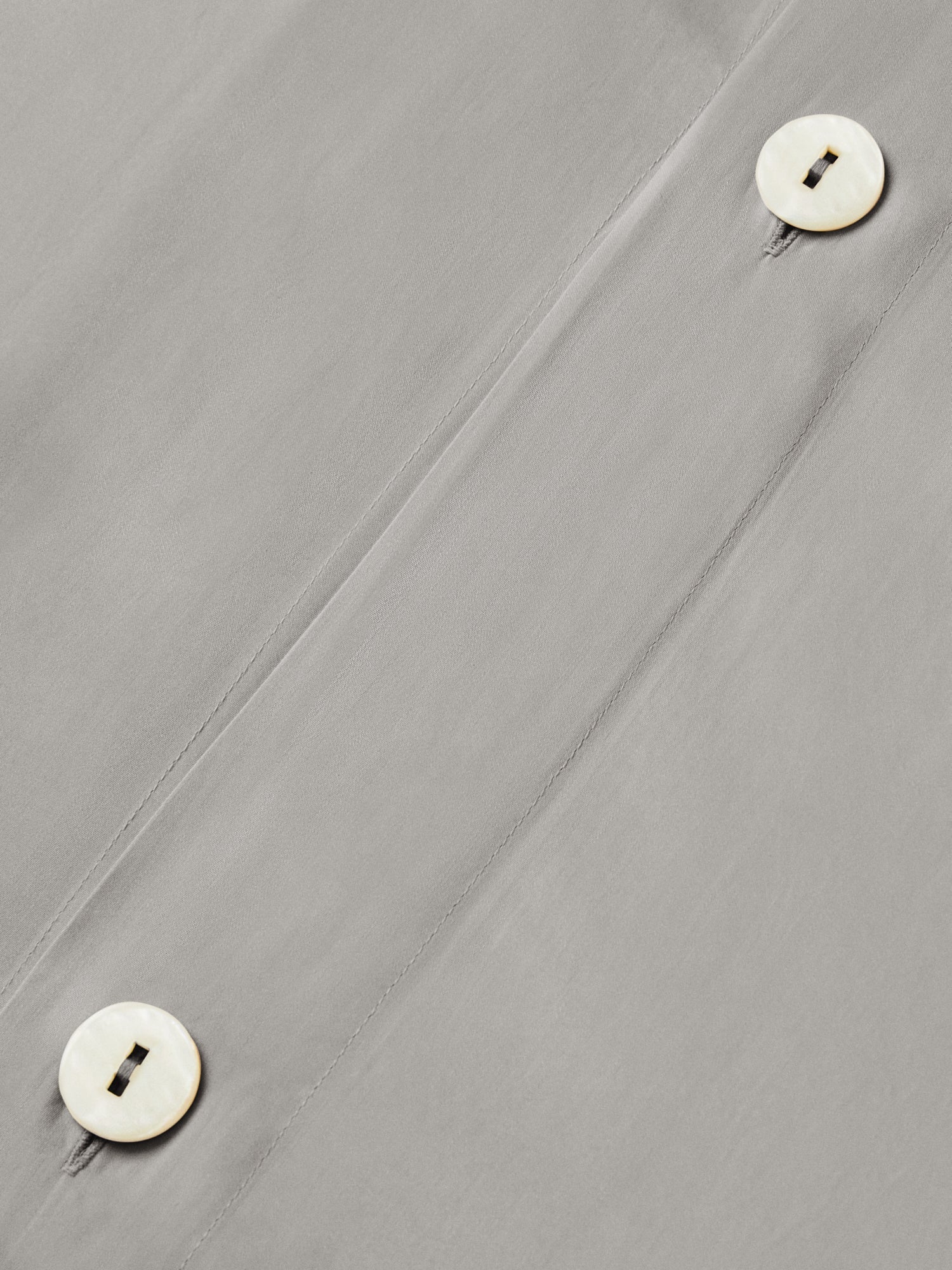 Close-up of hidden button closure on the Spanish Slate duvet cover. {{Spanish Slate}}