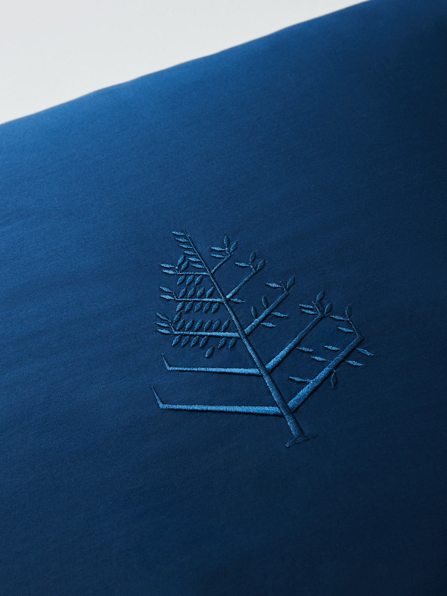 Close-up of Riviera Navy Euro sham with tone-on-tone logo store embroidery. {{Riviera Navy}}