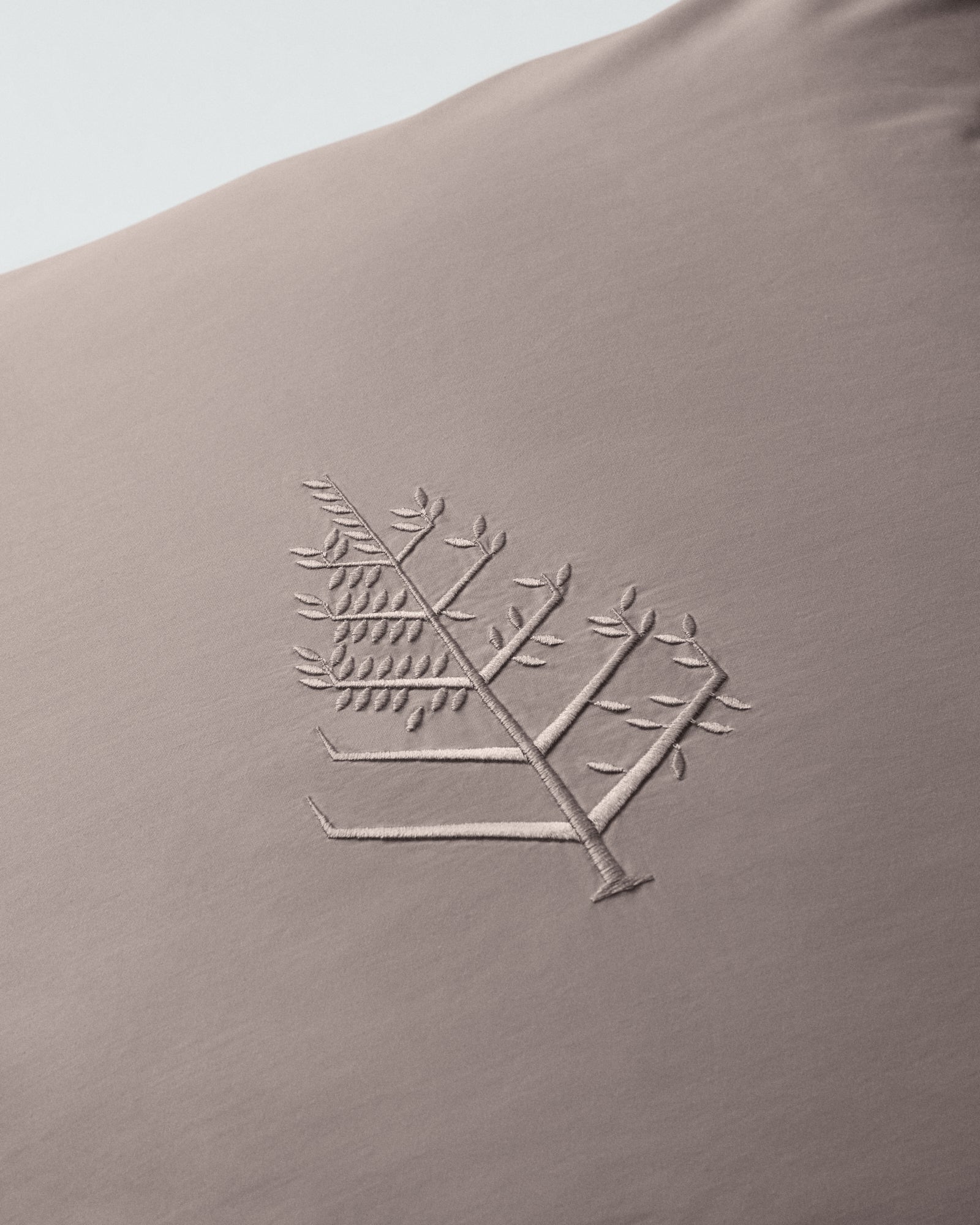 Close-up of the embroidered store logo on a Moroccan Sand Euro sham. {{Moroccan Sand}}