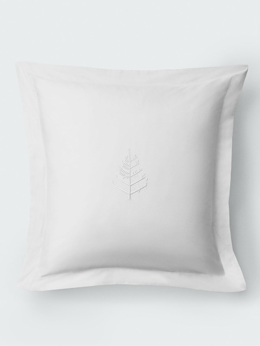 Euro sham in Signature White with a flange border and centered tone-on-tone embroidered leaf store logo. {{Signature White}}