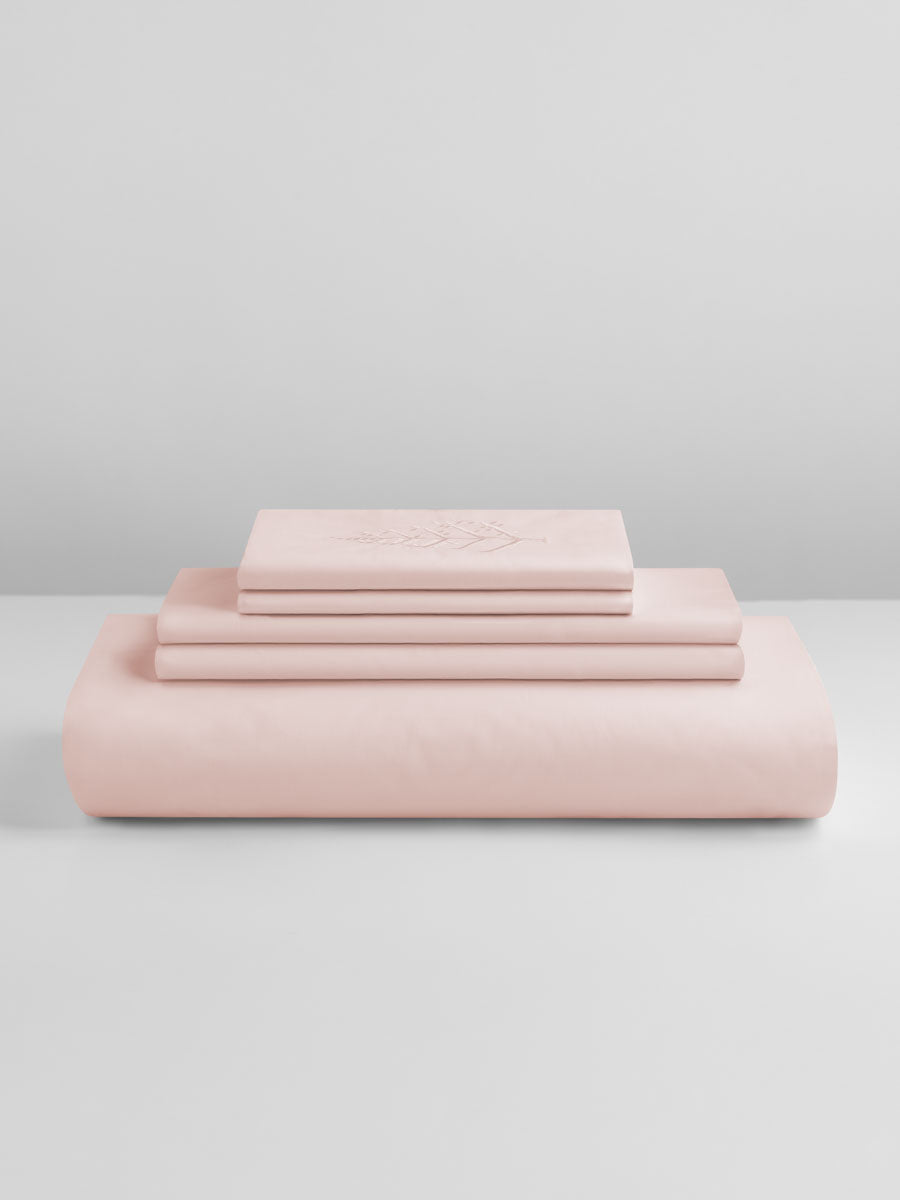 Kyoto Blush duvet cover set stacked: folded duvet and shams; top piece with tone-on-tone logo store embroidery. {{Kyoto Blush}}