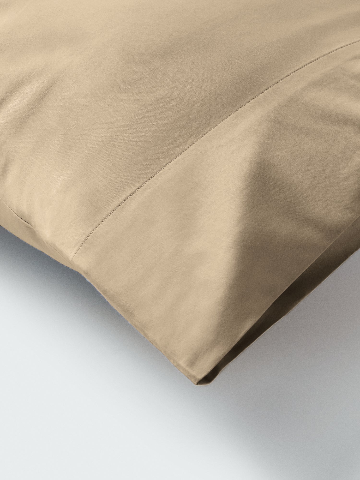 Part of a pillow with a pillowcase in Egyptian Camel color. - {{Egyptian Camel}}