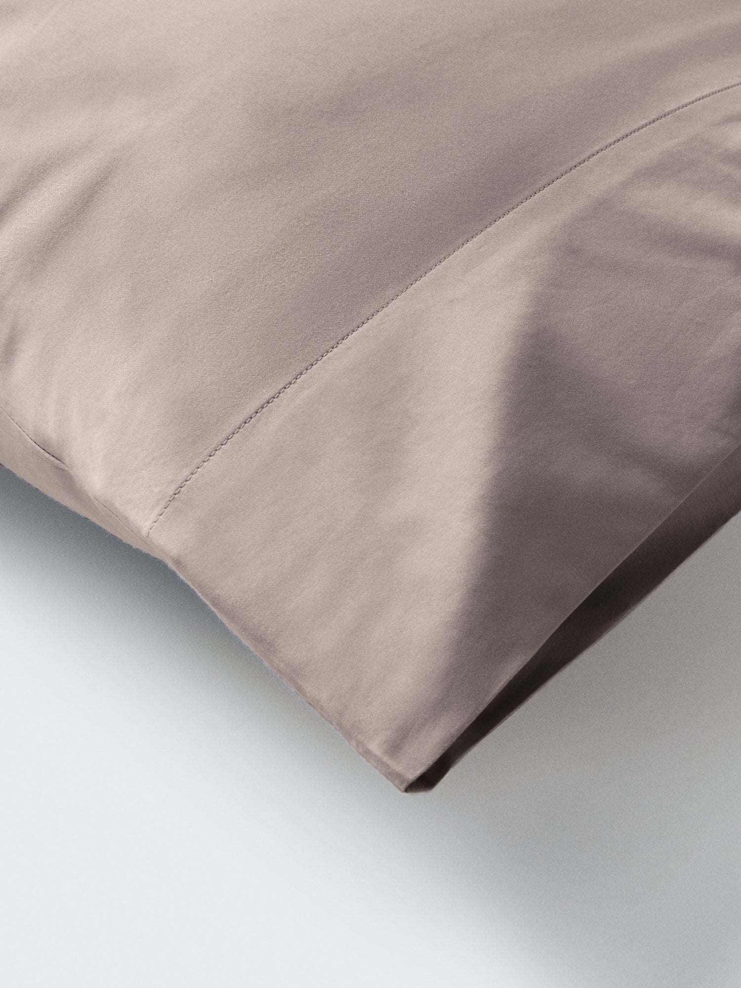 Part of a pillow with a pillowcase in Moroccan Sand color. - {{Moroccan Sand}}