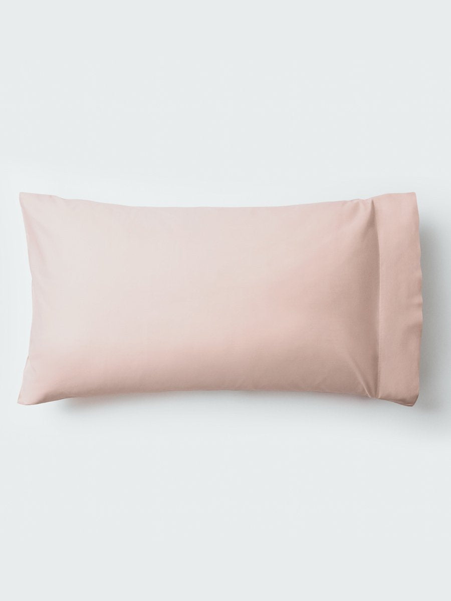 A pillow with an elegant Kyoto Blush color pillowcase. - {{Kyoto Blush}}