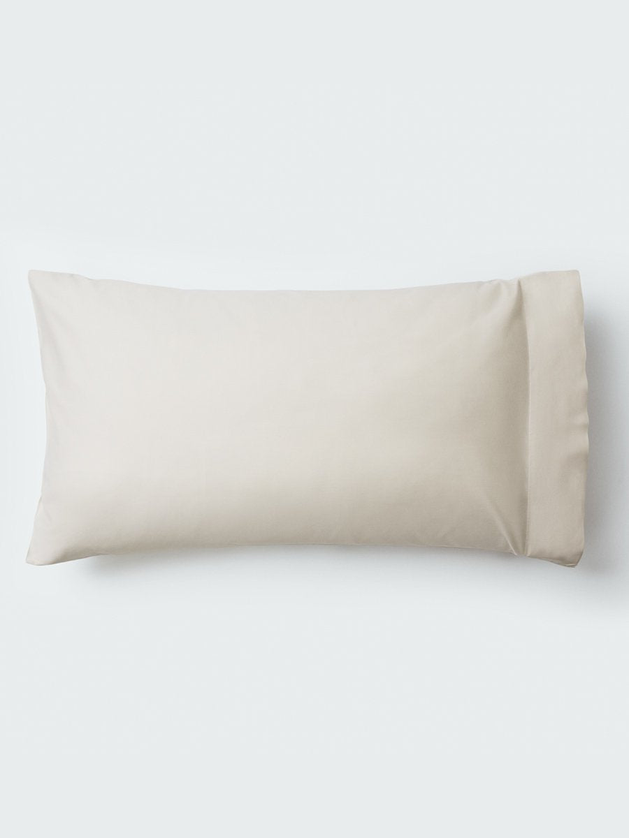 A pillow with an elegant Balinese Pearl color pillowcase. - {{Balinese Pearl}}