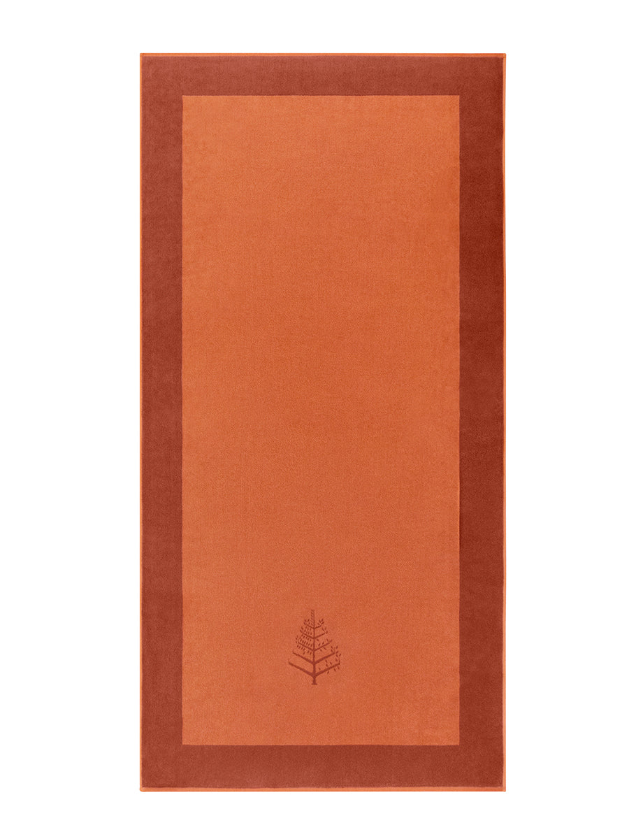 A "Sicilian Dawn" Resort Towel with a subtle embroidered Four Seasons logo. The towel features a darker border. - {{Sicilian Dawn}}