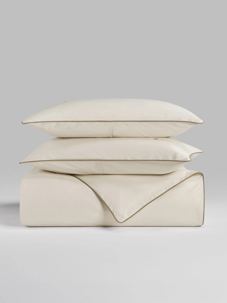 Sycamore Balinese Pearl duvet cover set stacked folded duvet and pillowcases. {{Balinese Pearl}}