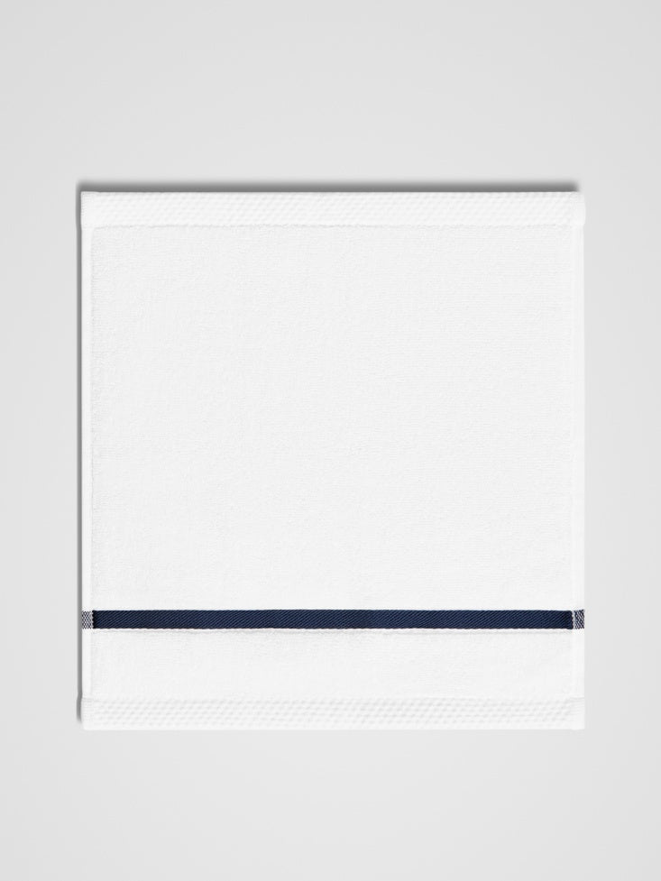 Sycamore Wash Cloth, with navy piping detail. {{Signature White}}