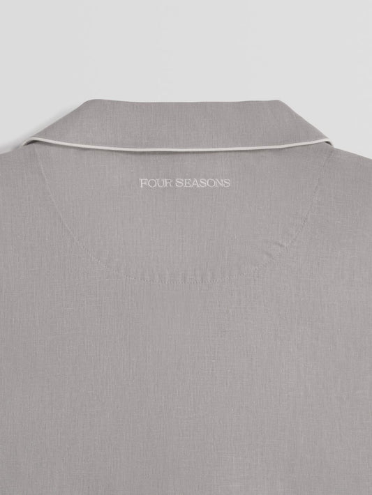 Gray shirt with 'Four Seasons' logo on a light gray background