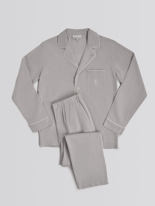 Gray pajama set with a shirt and pants on a light gray background