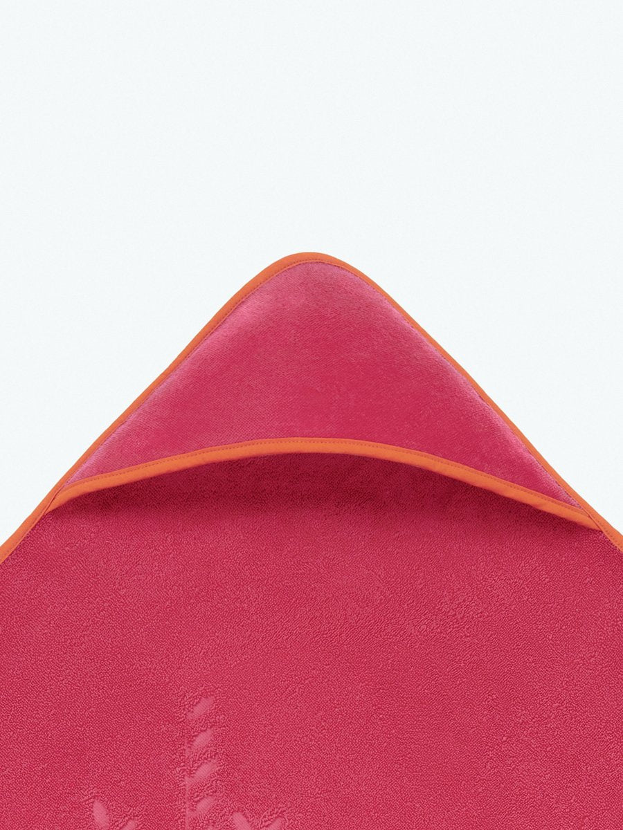 Close-up of the hooded end of a "Coral Reef Pink" baby towel. - {{Coral Reef Pink / Mountain Grey}}