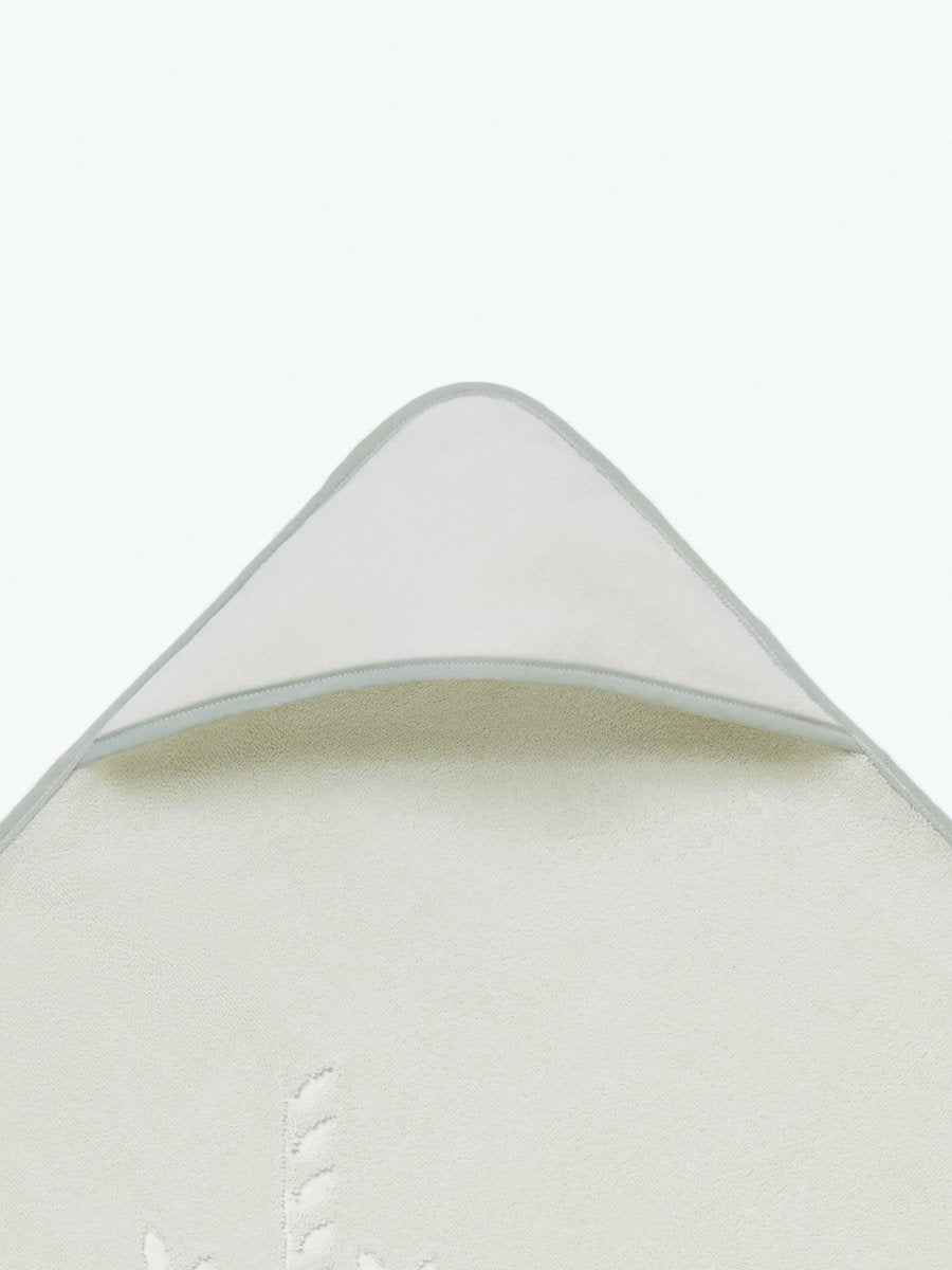 Close-up of the hooded end of a "Safari Sage" baby towel. - {{Safari Sage / Mountain Grey}}