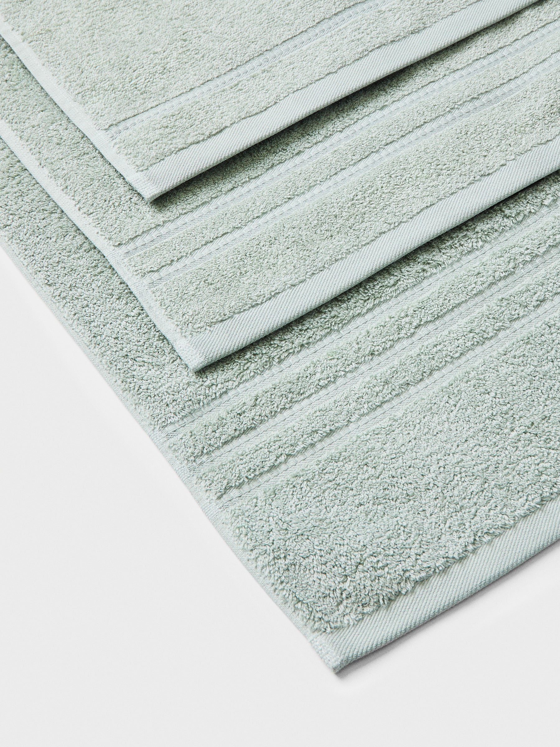 towel set in Florentine Sage, finished with a patterned dobby border. - {{Florentine Sage}}
