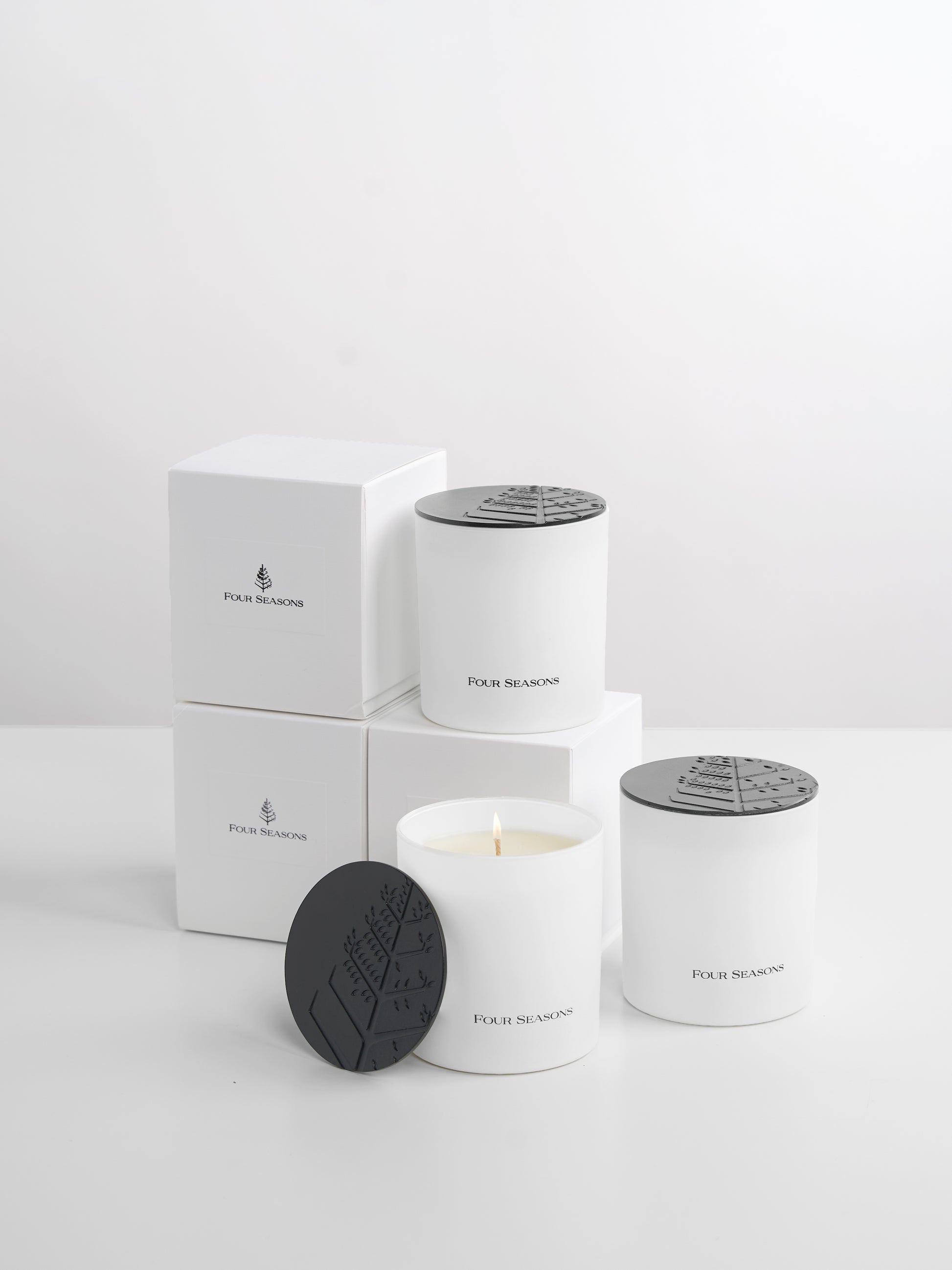 Four Seasons Candle Set featuring three popular scents: Champagne Wonderland, Island Splendour, and Urban Sanctuary.