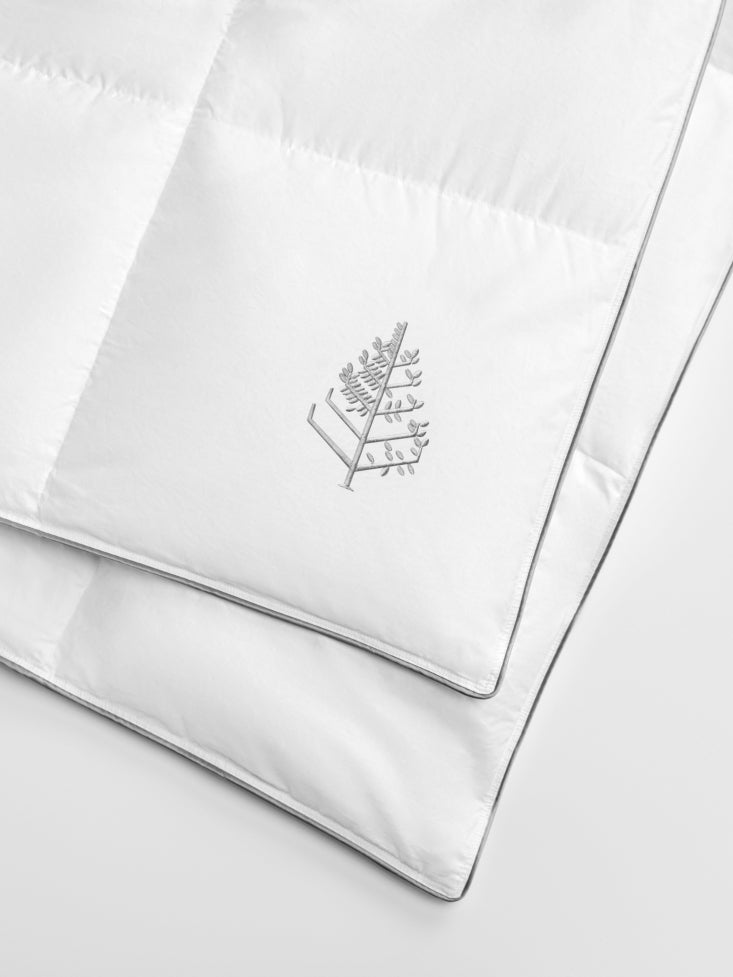 White pure down duvet with a Four Seasons Logo on a white background.