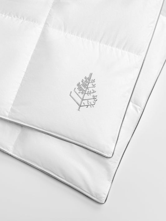 White pure down duvet with a Four Seasons Logo on a white background.