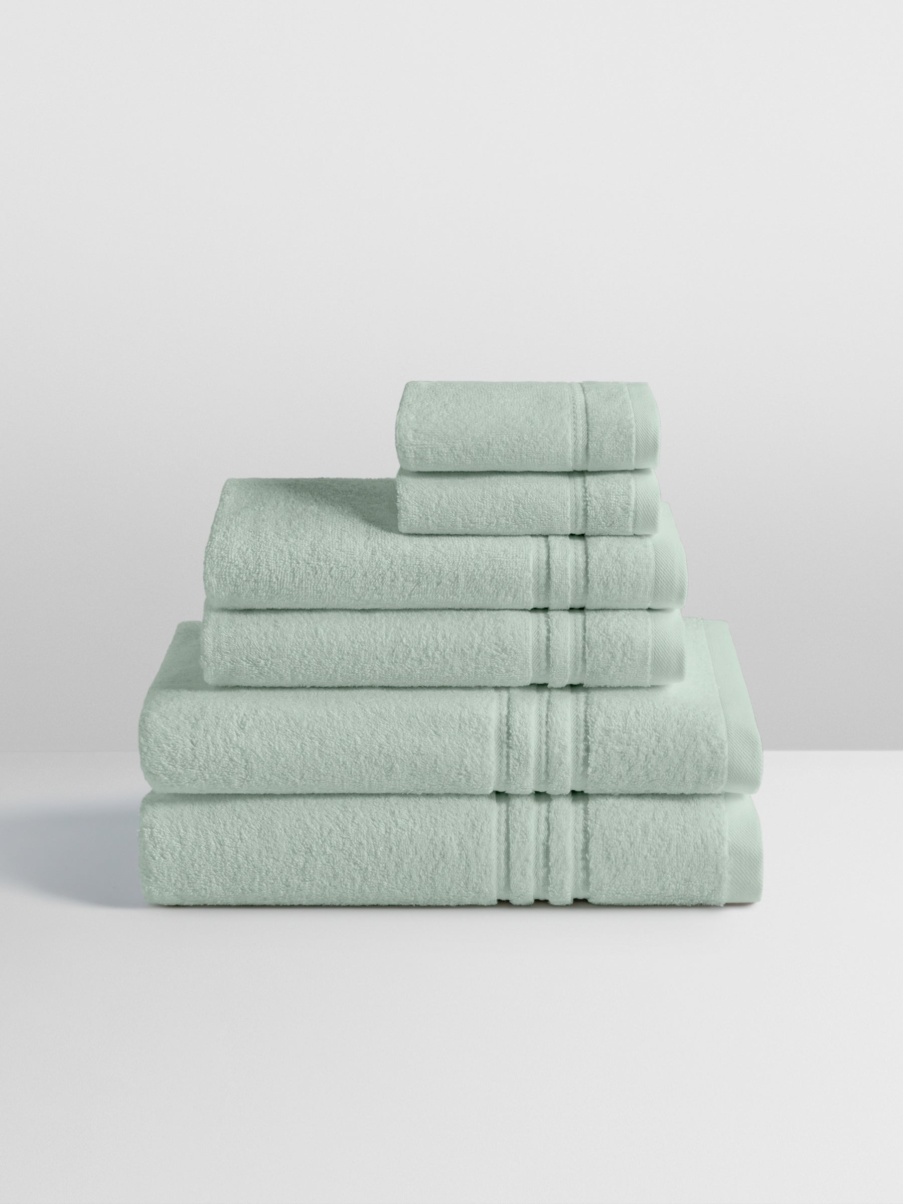 6-piece colored towel set in Florentine Sage, finished with a patterned dobby border. - {{Florentine Sage}}