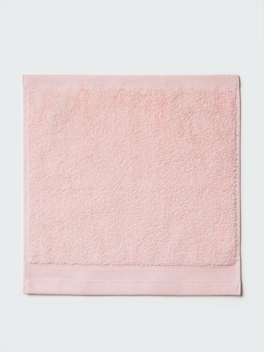 Close-up of a "Kyoto Blush" colored wipe, visible fabric