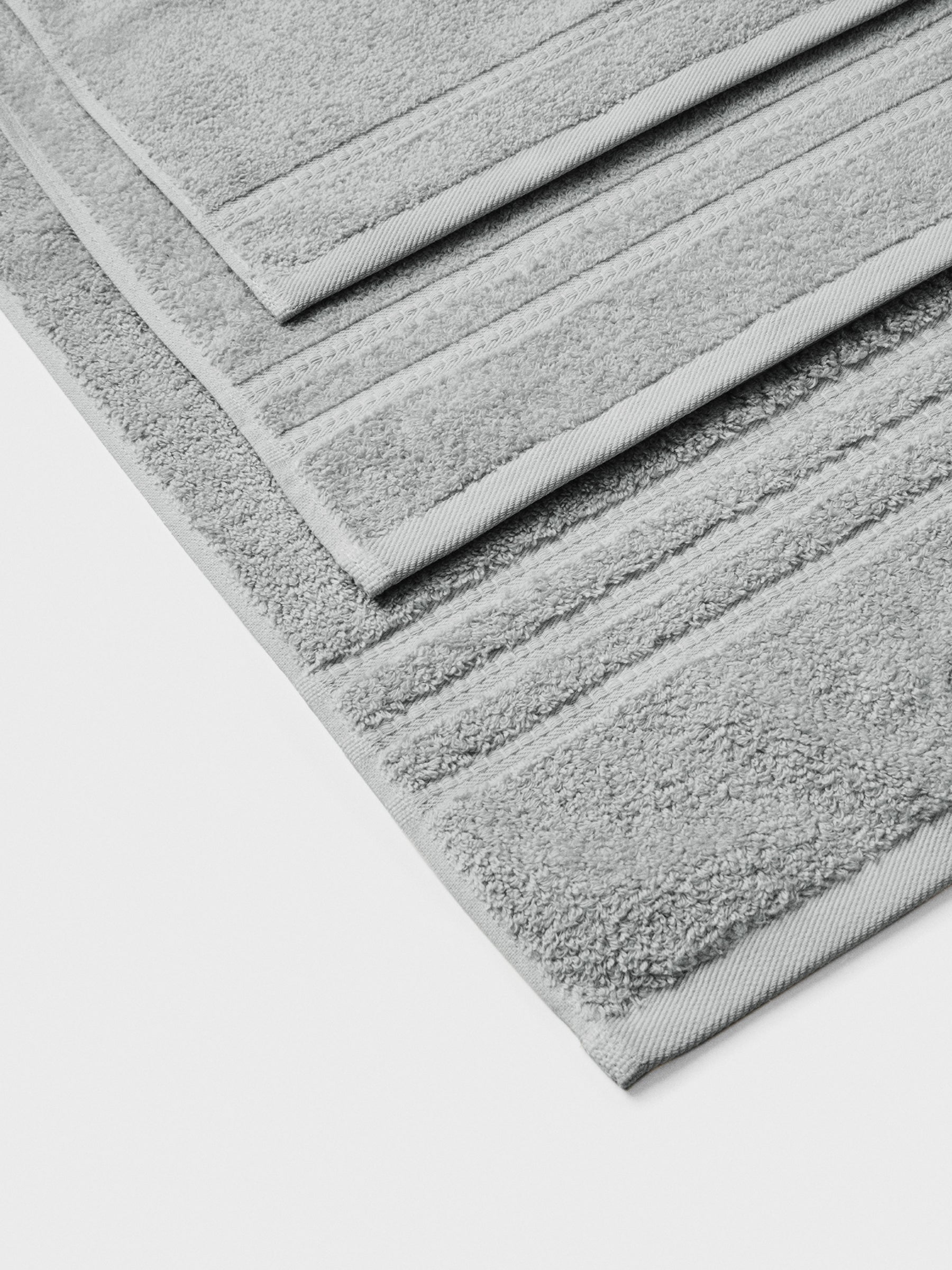 towel set in Spanish Slate, finished with a patterned dobby border. - {{Spanish Slate}}