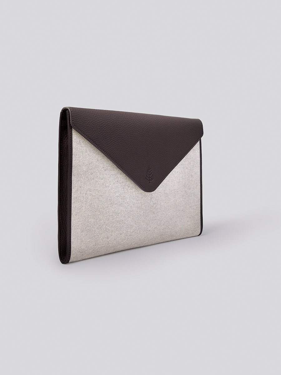 The Laptop Sleeve, a protective and stylish case for your laptop or tablet, crafted from Italian Pebble Grain Leather and Organic Cotton Toile. - {{Malaysian Cocoa}}