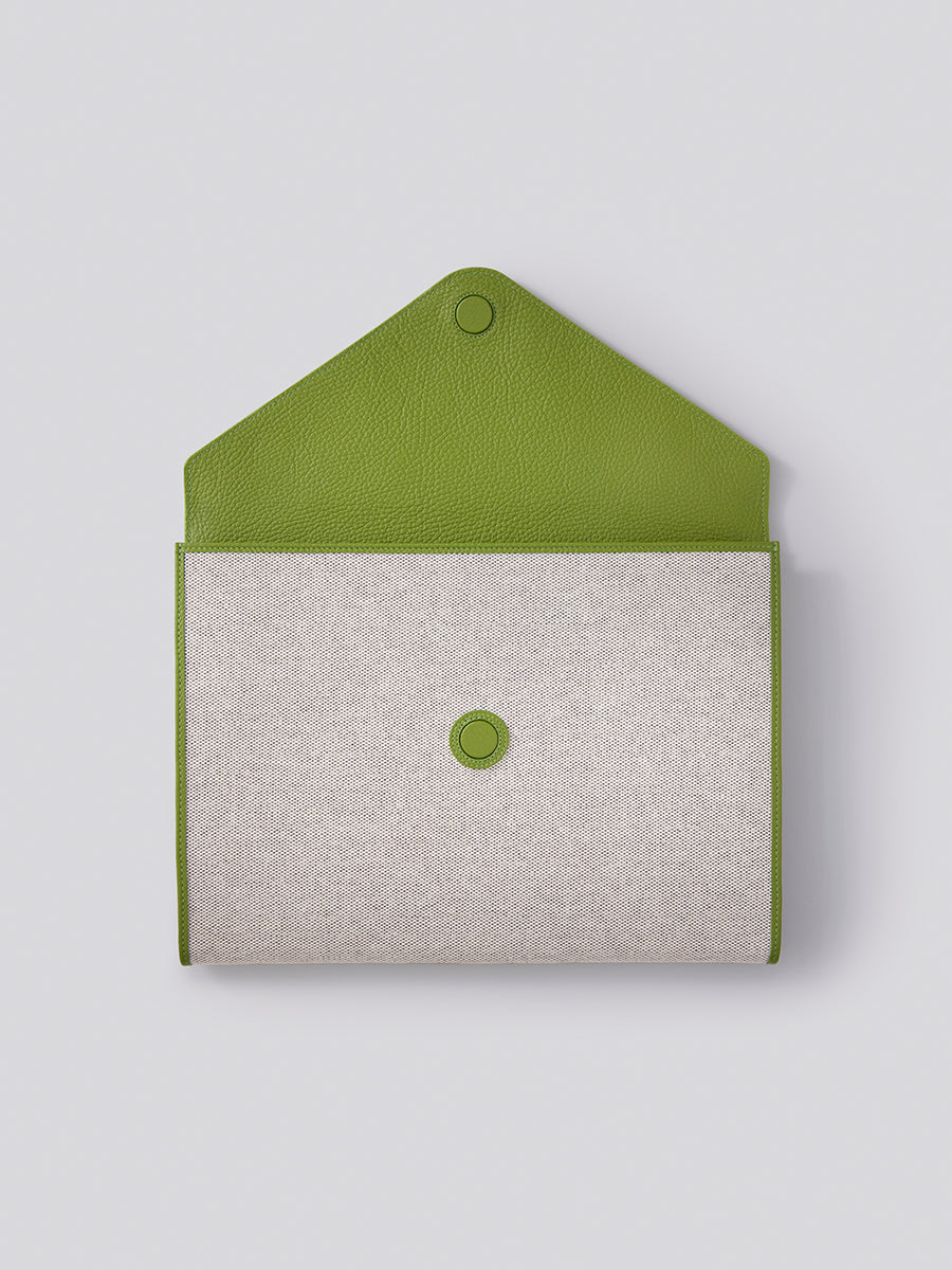 The Laptop Sleeve in Kyoto Matcha from the Four Seasons Travel Collection with the interior visible. - {{Kyoto Matcha}}