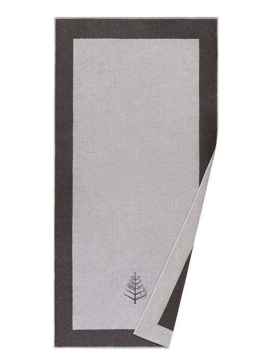 A "Hampshire Charcoal" Resort Towel with a subtle embroidered Four Seasons logo. The towel features a darker border and is folded on a white background. - {{Hampshire Charcoal}}