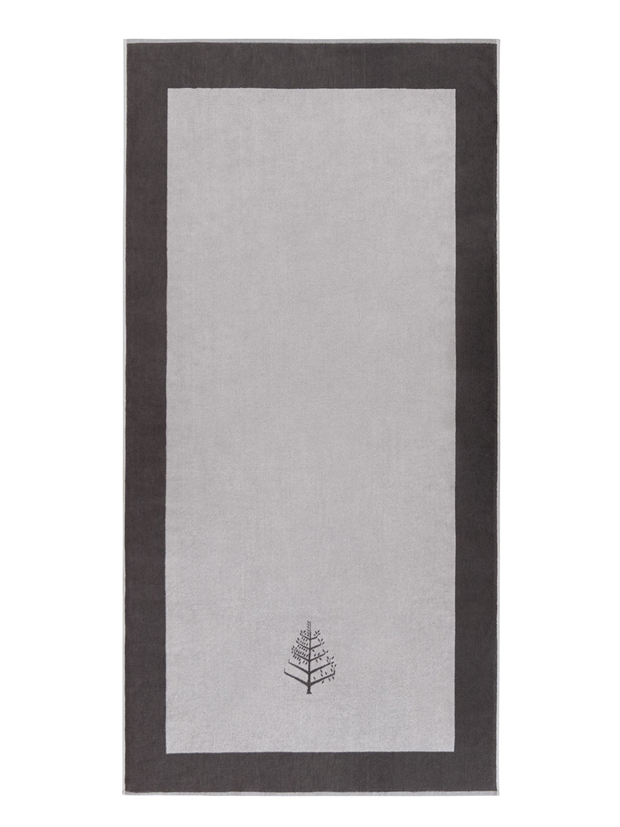 A "Hampshire Charcoal" Resort Towel with a subtle embroidered Four Seasons logo. The towel feature a darker  border.