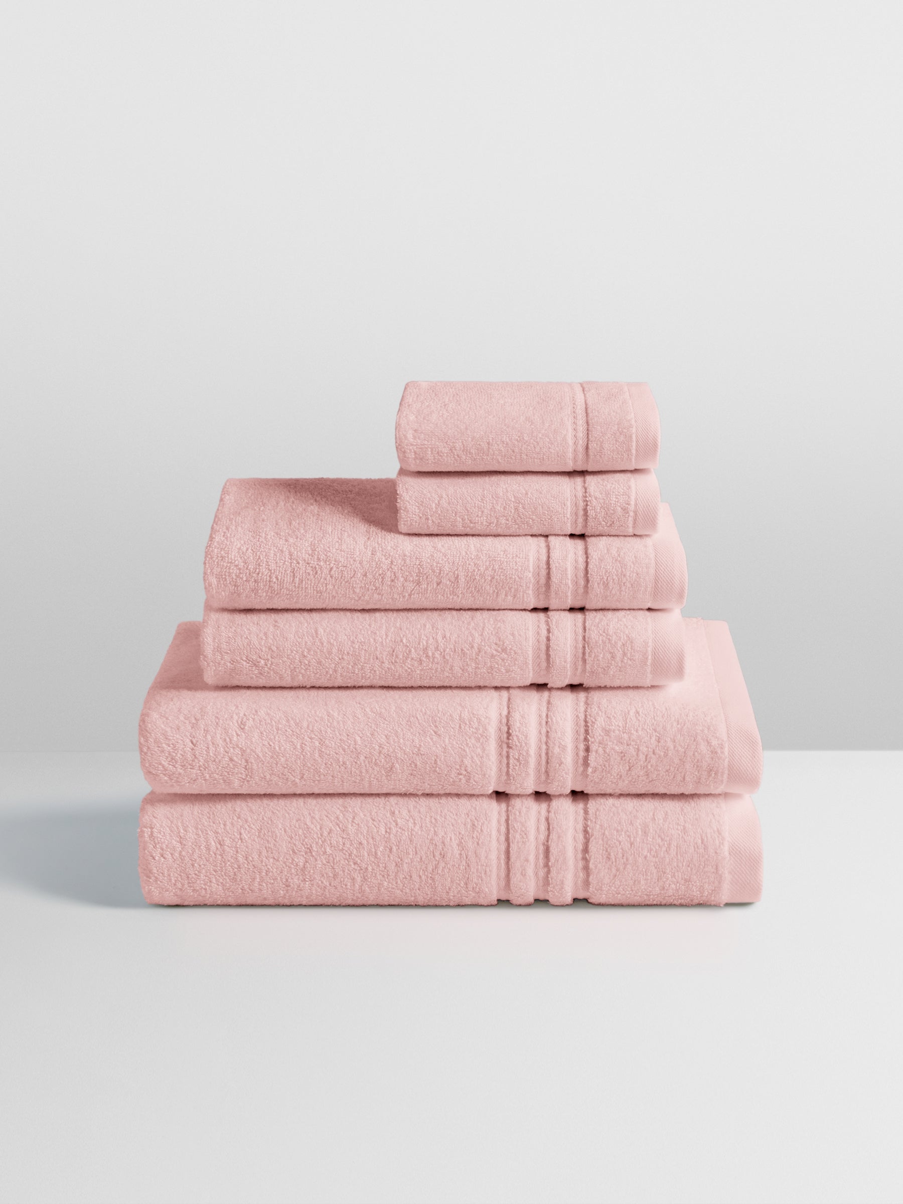 6-piece colored towel set in Kyoto Blush, finished with a patterned dobby border.