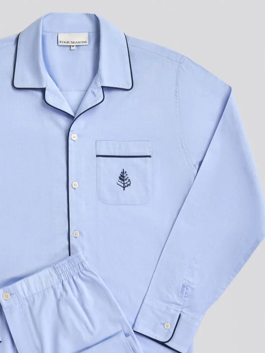 Light blue pajama set with a Four Seasons Logo embroidered design on a light gray background