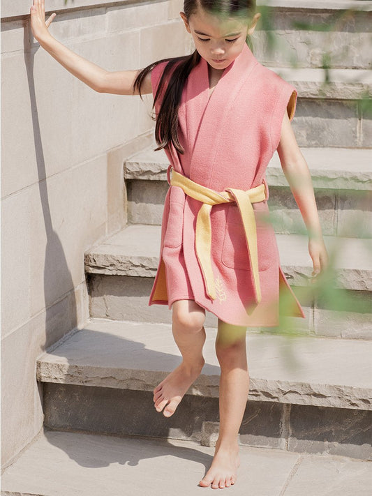 Little girl dressed in a Four Seasons Resort children's robe, sleeveless, light wool, pink with yellow interior, elegant and stylish - {{Coral Reef Pink}}