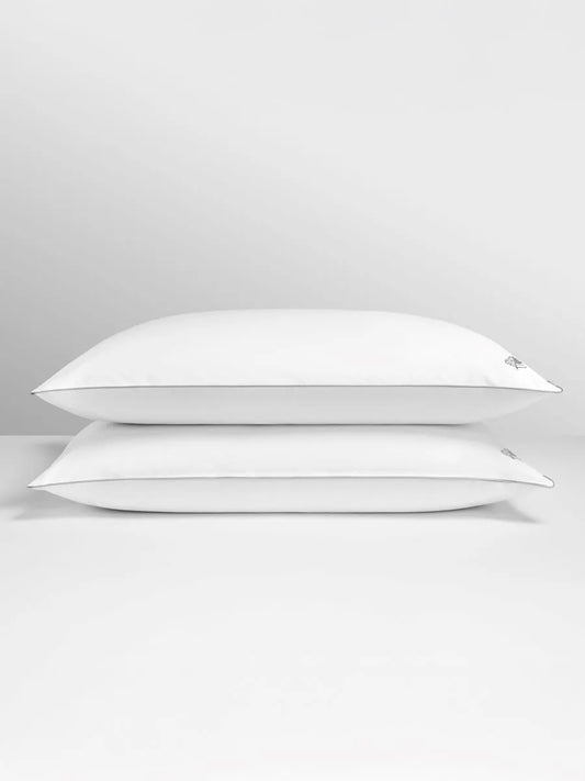 Two white pillows on a light gray background