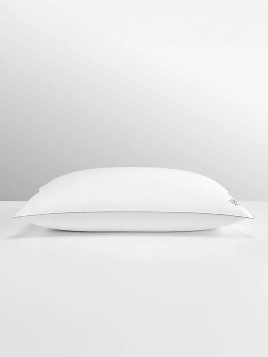 White pillow on light grey background.
