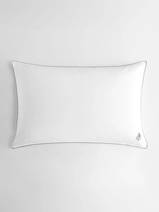 White pillow on a light gray background