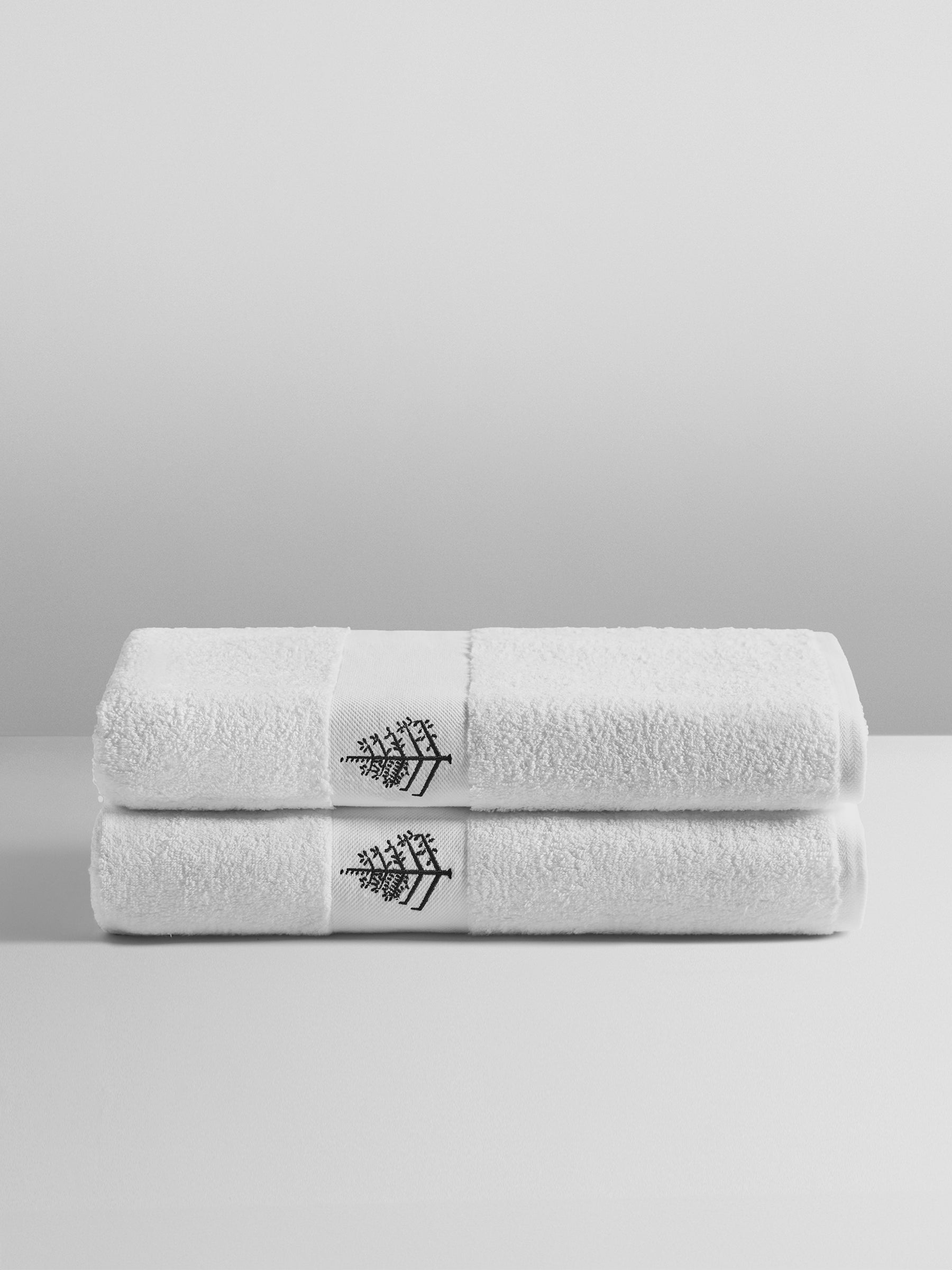 Four Seasons Pool Towel Set, lush white towels with black embroidered logo, made from super combed cotton