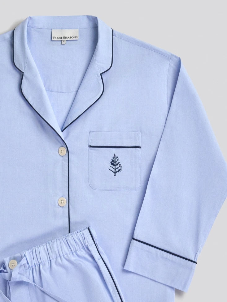 Light blue pajama set with a Four Seasons Logo embroidered design on a light gray background
