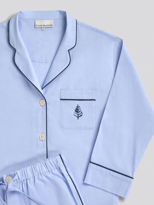 Light blue pajama set with a Four Seasons Logo embroidered design on a light gray background