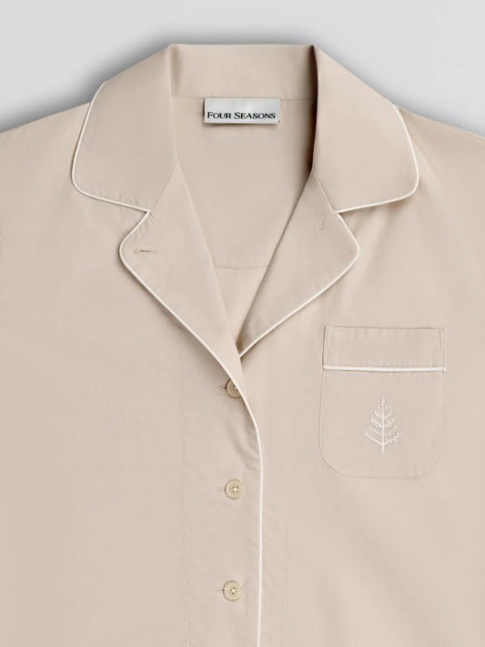 Balinese pearl pajama shirt with collar and pocket detail, featuring 'Four Seasons' branding on front logo with white piping trim. {{Balinese Pearl}}