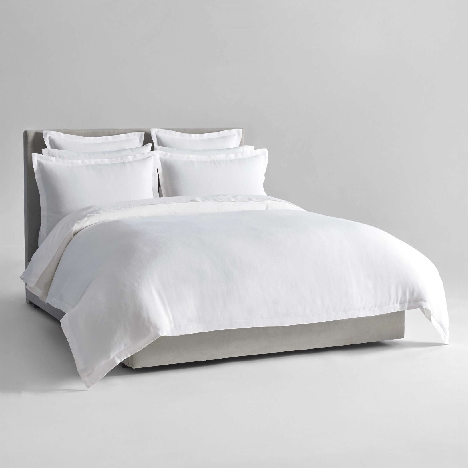 Acacia Dream Set in Signature White—linen duvet with layered Euro and standard shams, front view on a neutral bed - {{Signature White}}