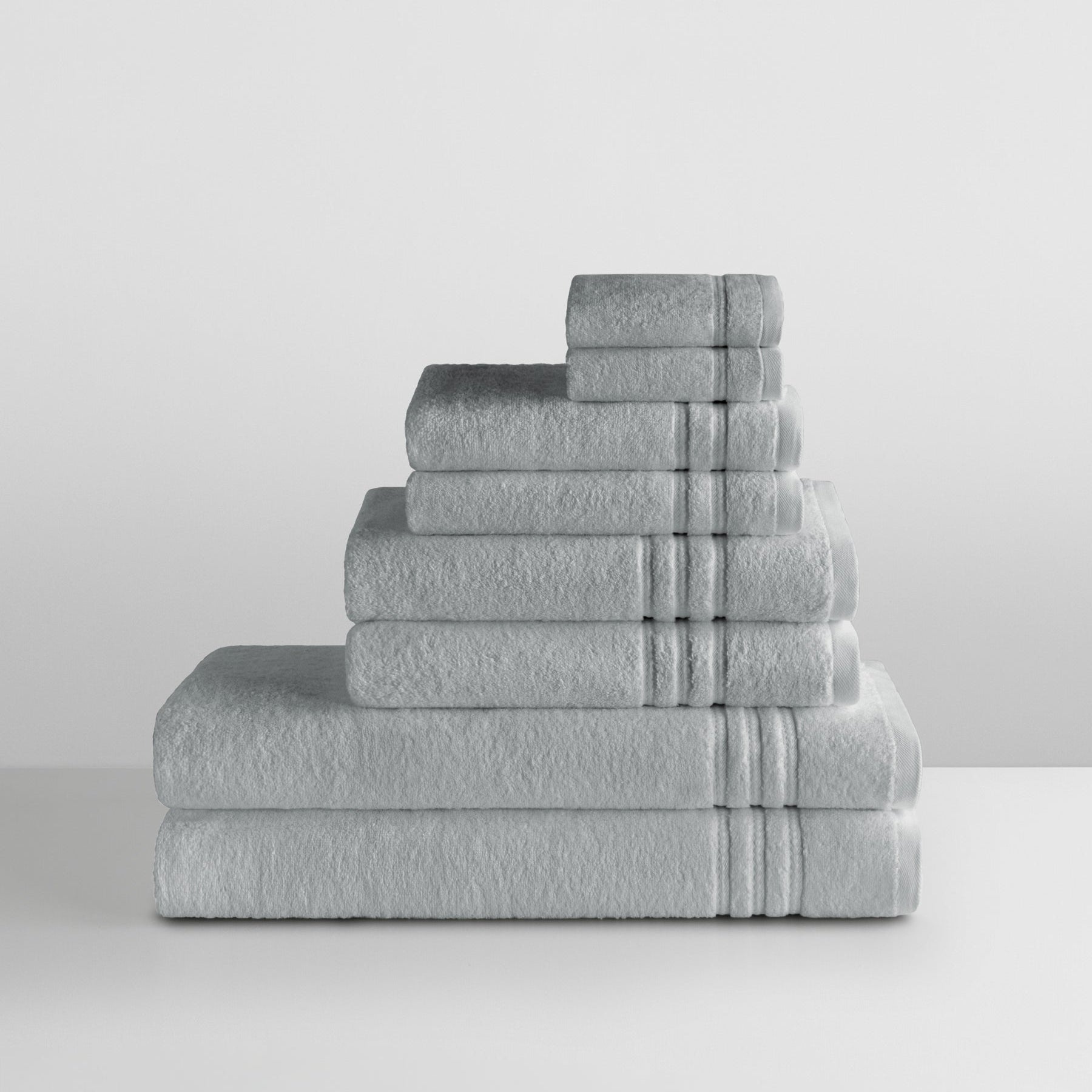 Bath Towel Ensemble in Spanish Slate—stacked set showing terry texture and patterned dobby border. - {{Spanish Slate}}