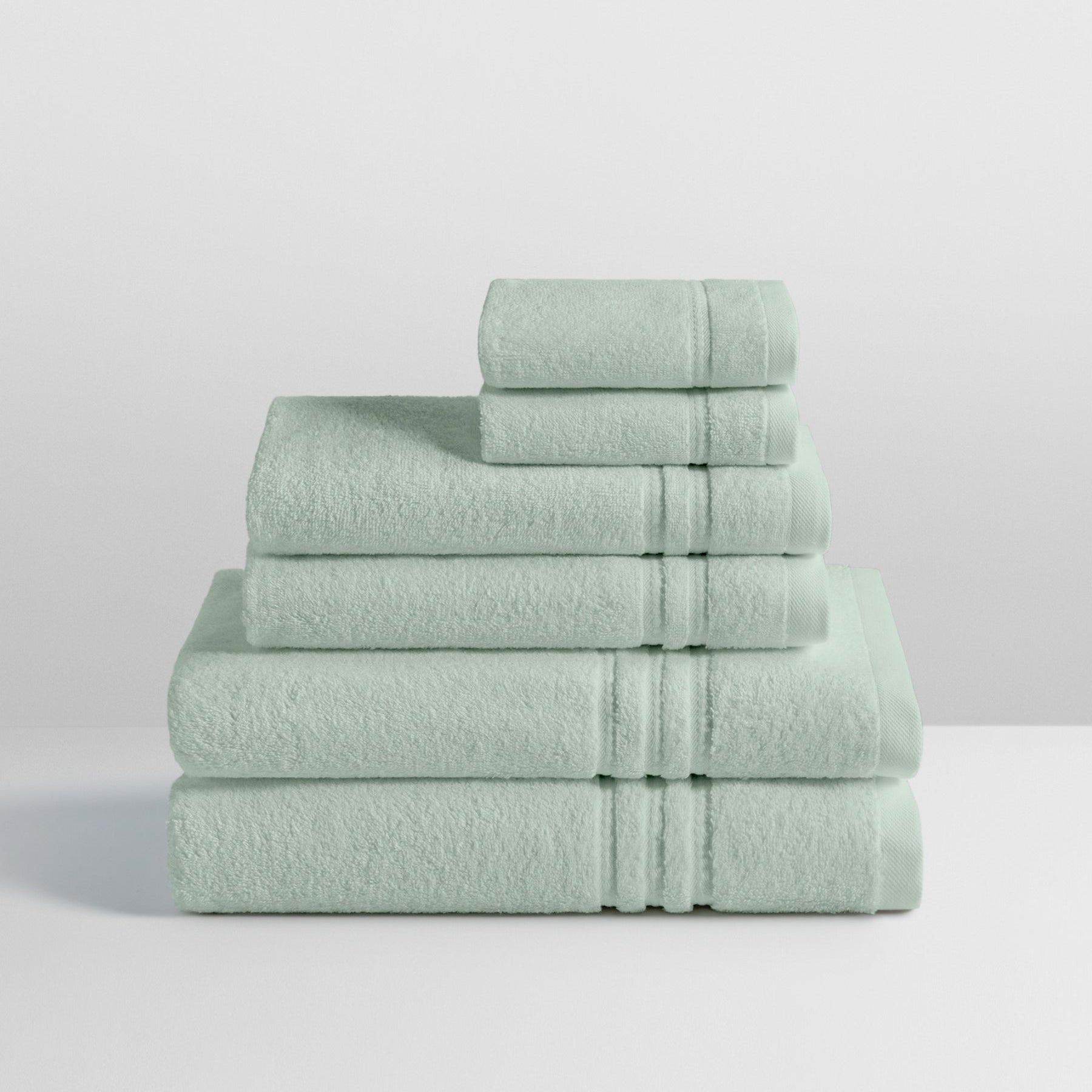 6-piece colored towel set in Florentine Sage, finished with a patterned dobby border. - {{Florentine Sage}}