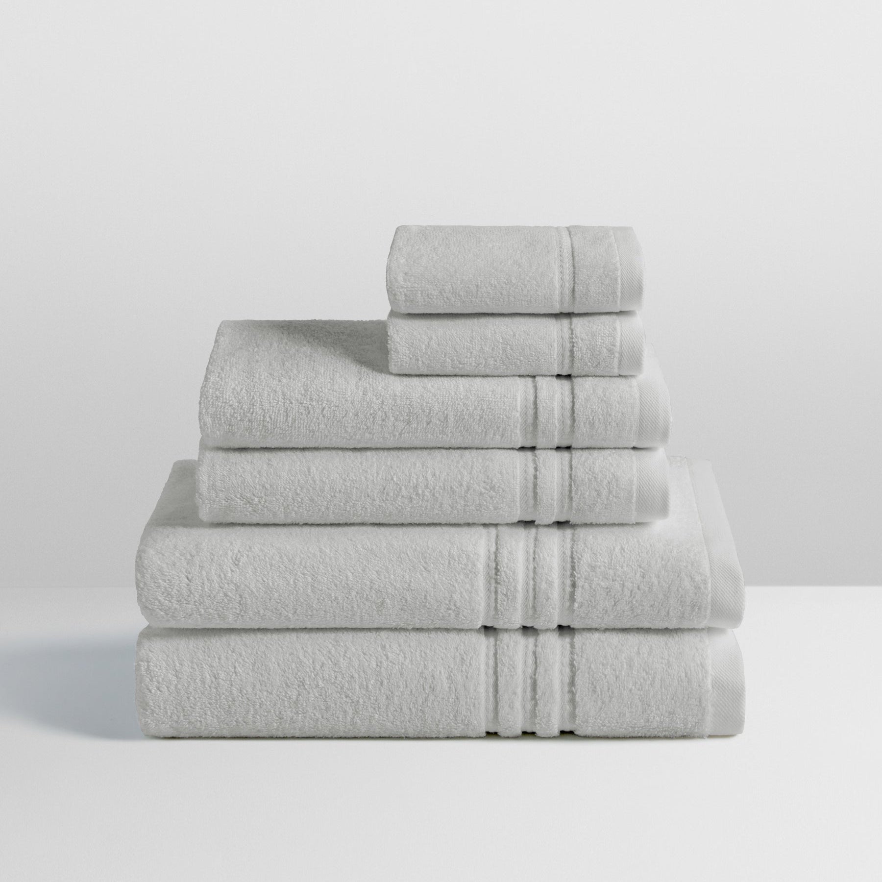 6-piece colored towel set in Turkish Silver, finished with a patterned dobby border. - {{Turkish Silver}}