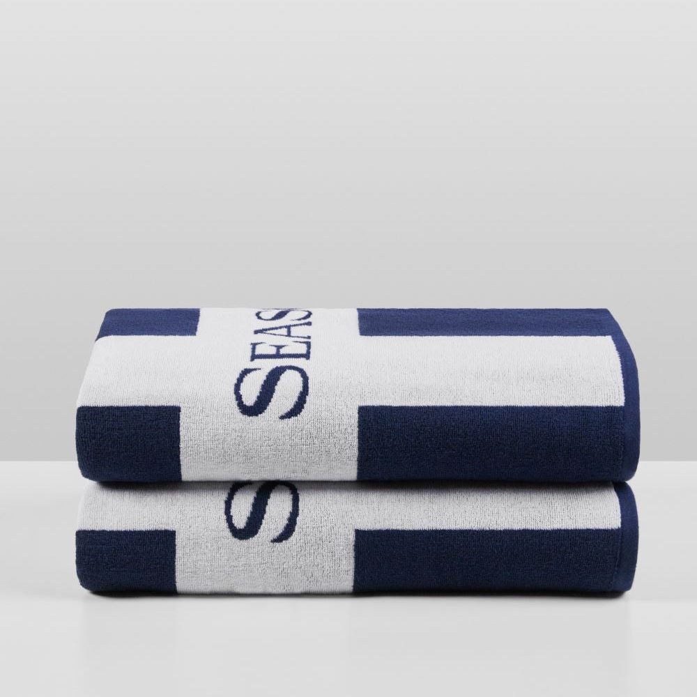 Cabana Towel Set in Maritime Navy—two grand-sized towels folded, bold navy-and-white stripes with woven “Four Seasons” logo visible. {{Maritime Navy}}