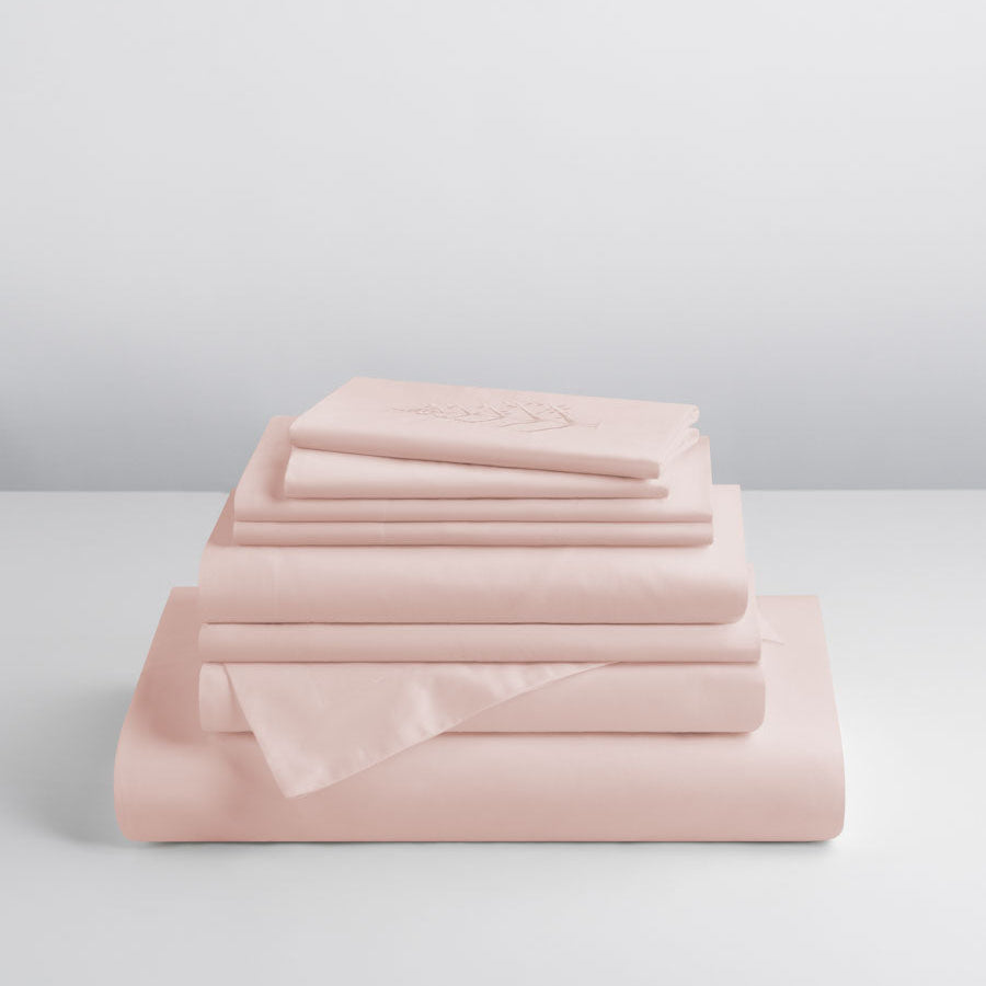 Kyoto Blush-colored sheet set, stacked on top of each other, soft and comfortable. - {{Kyoto Blush}}