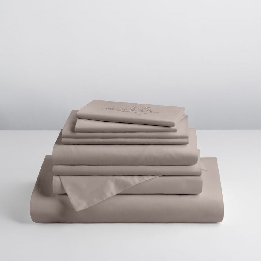 Moroccan Sand-colored sheet set, stacked on top of each other, soft and comfortable. - {{Moroccan Sand}}