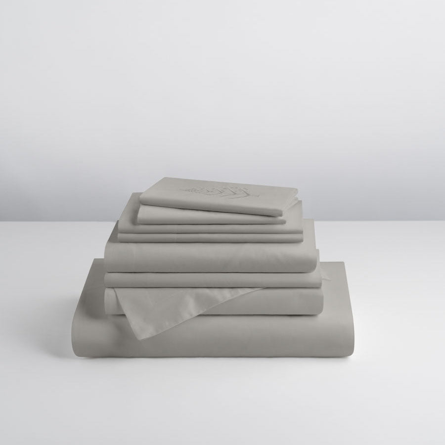 Spanish-Slate-colored sheet set, stacked on top of each other, soft and comfortable. - {{Spanish Slate}}