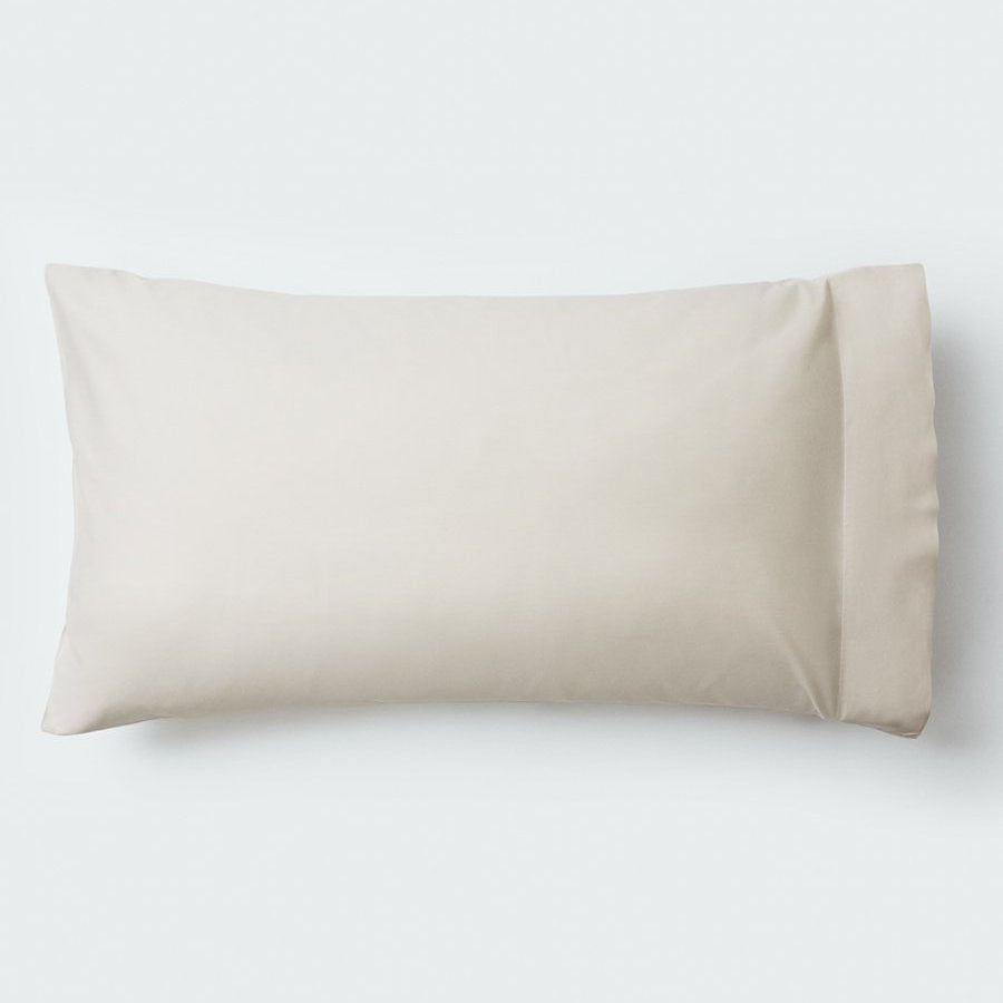 A pillow with an elegant Balinese Pearl color pillowcase. - {{Balinese Pearl}}